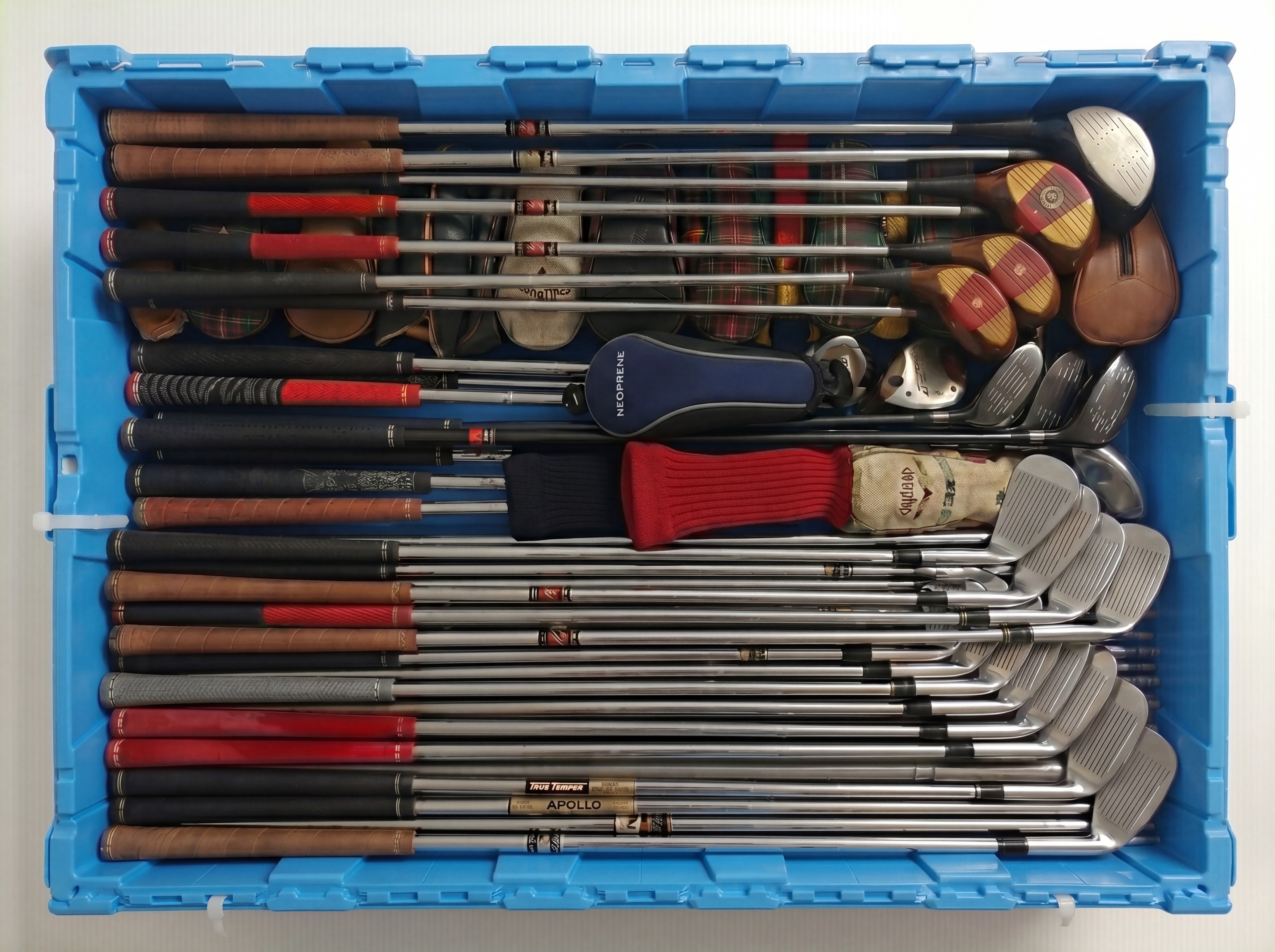 Golf clubs stored in a large Fort Lox box